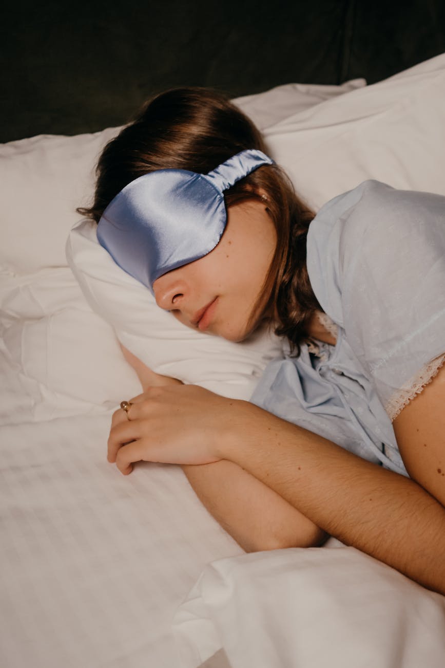 asleep woman wearing eye sleeping mask