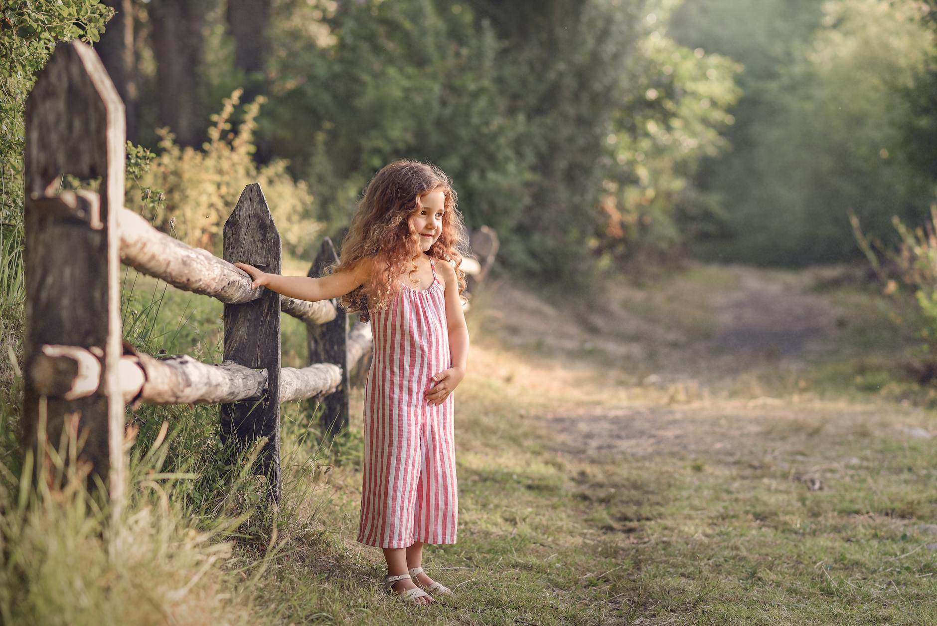 charming child in a summer countryside setting