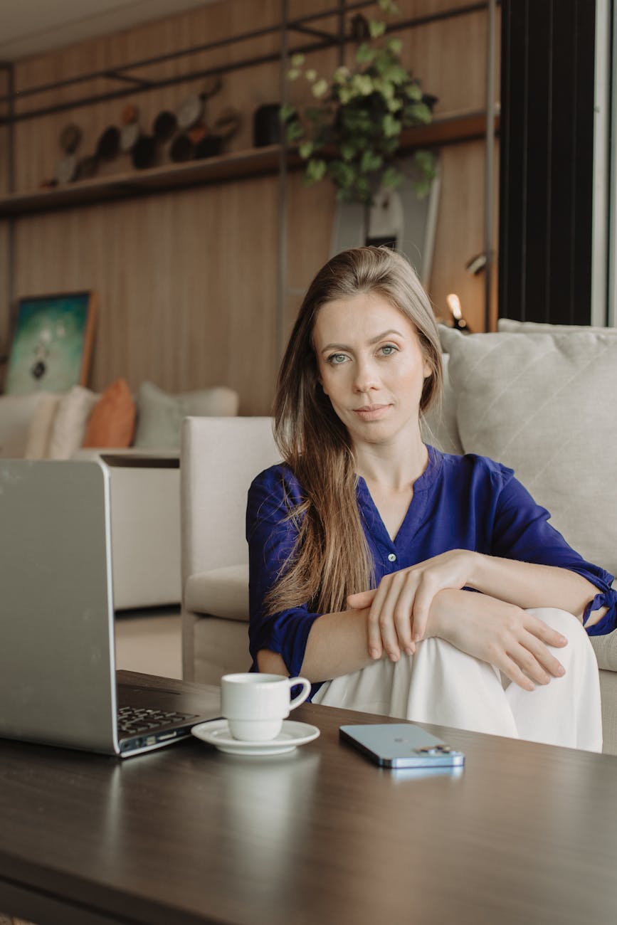 professional woman relaxing with coffee indoors