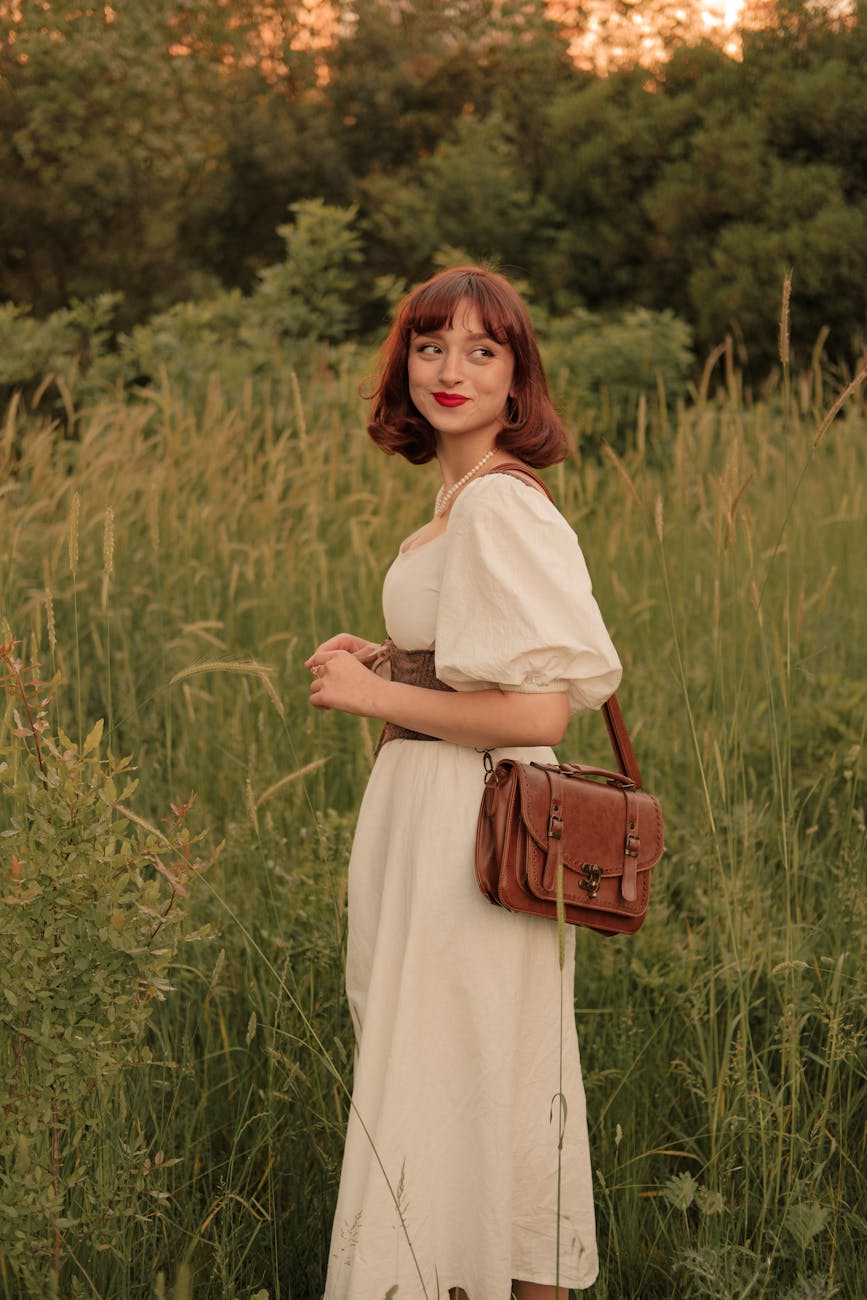 retro portrait of woman in dress with purse