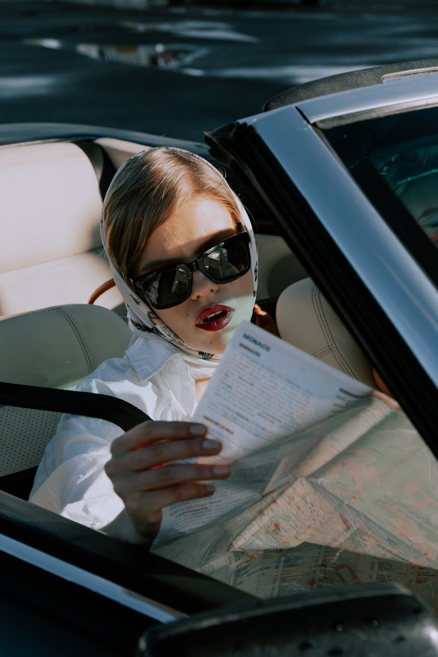 a beautiful woman reading a map