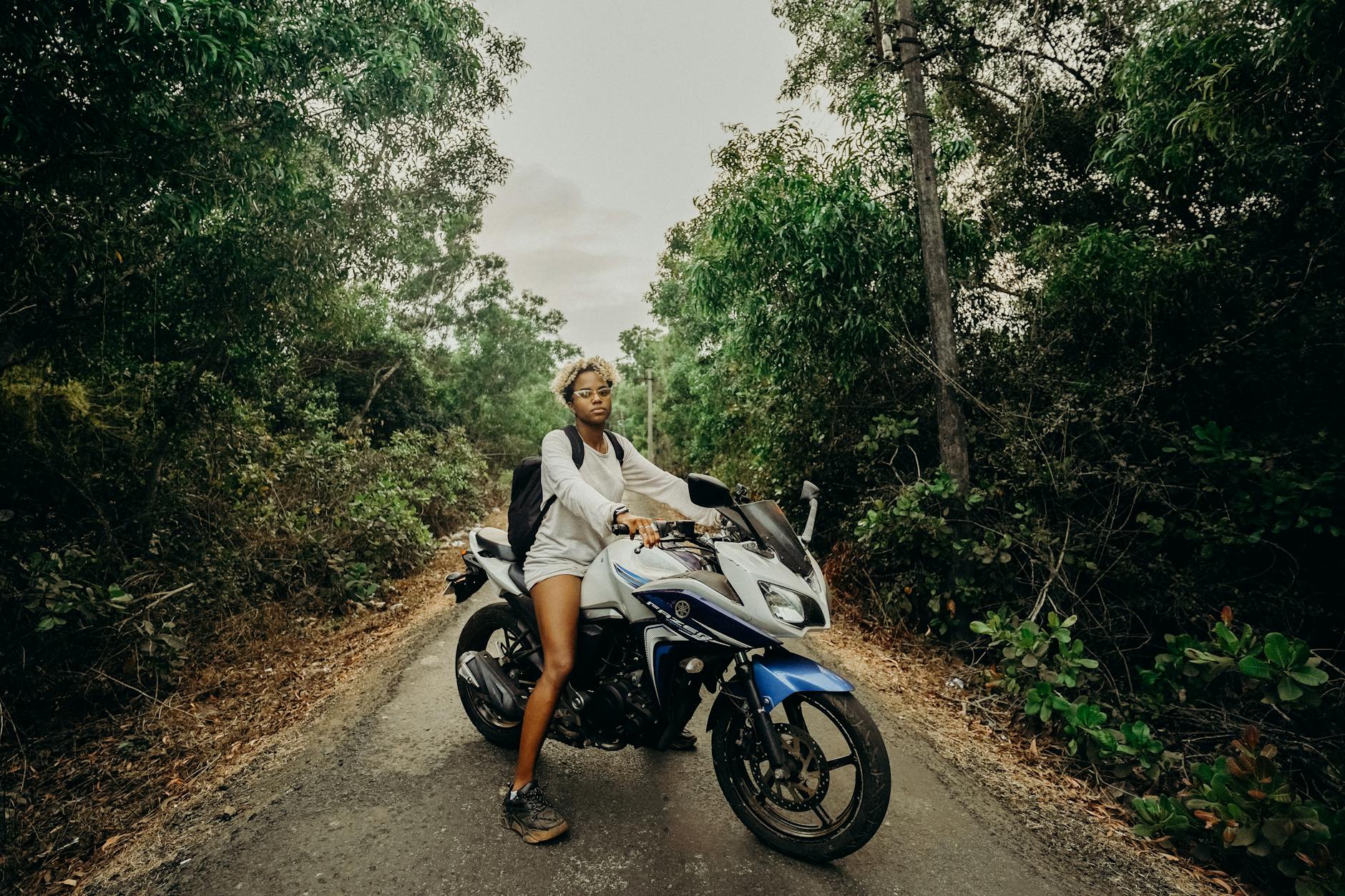 man and woman riding on motorcycle