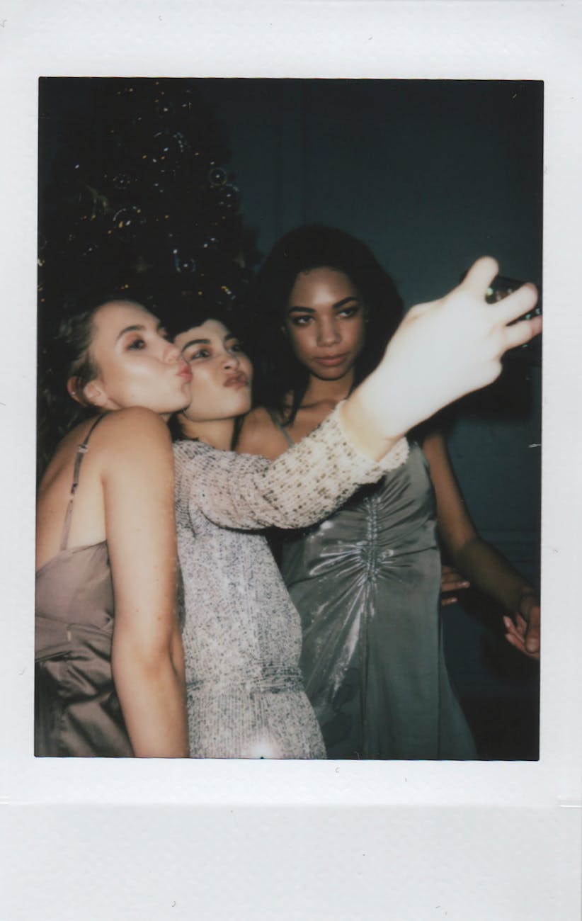 photo of women taking selfie