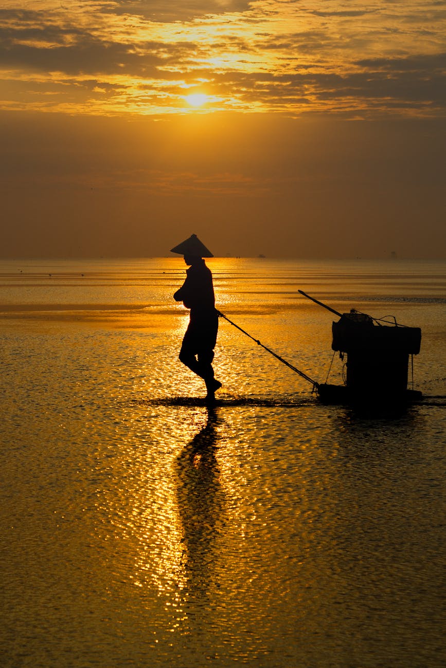 a man walking on the water with a fishing net