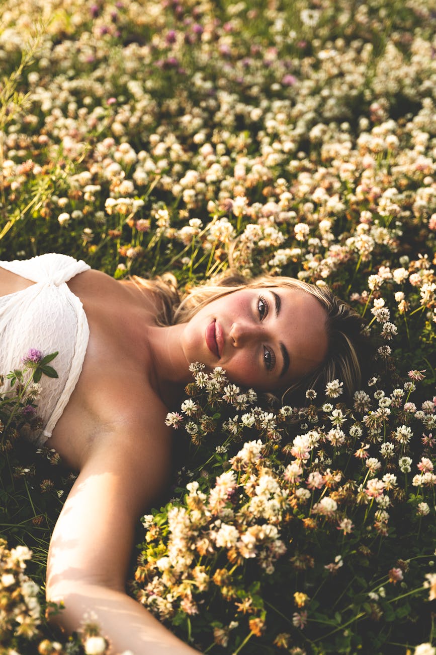 woman lying down among flowers