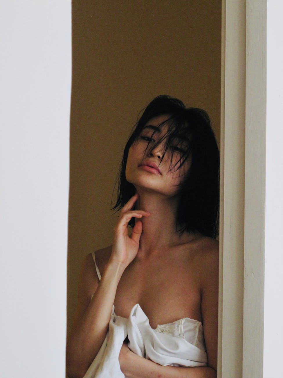 portrait of woman wrapped in a white sheet