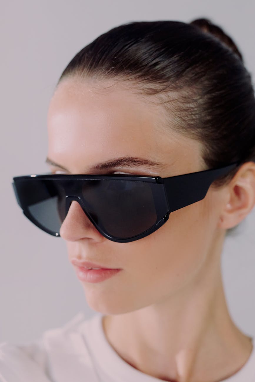 studio shot of woman in sunglasses
