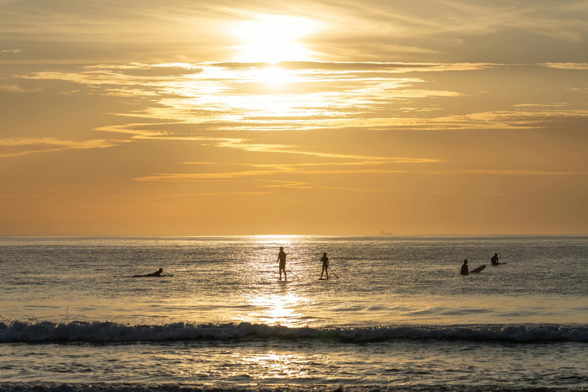 paddleboarders at sunrise in torquay australia