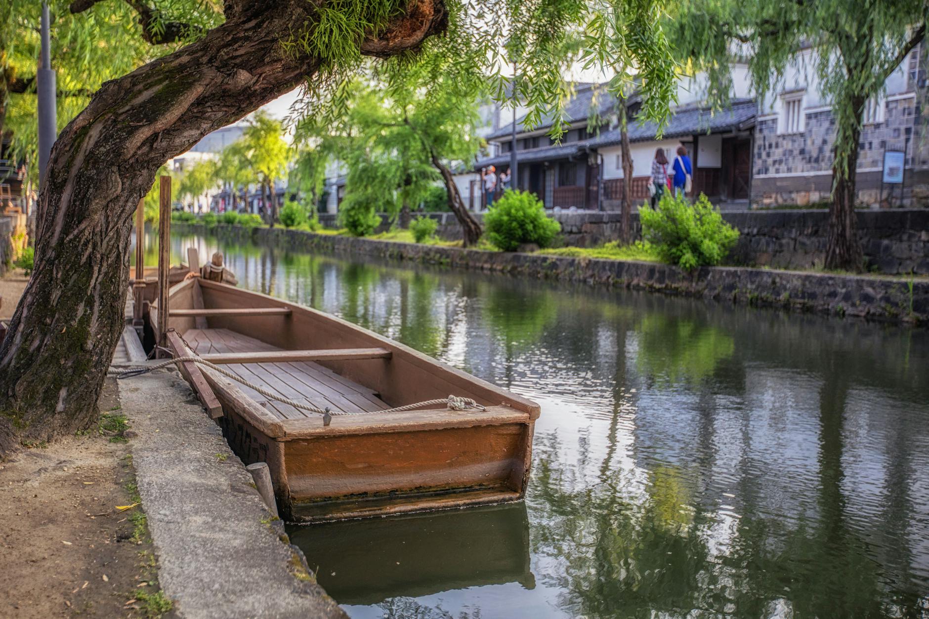 traditional boat on kurashiki canal in japan
