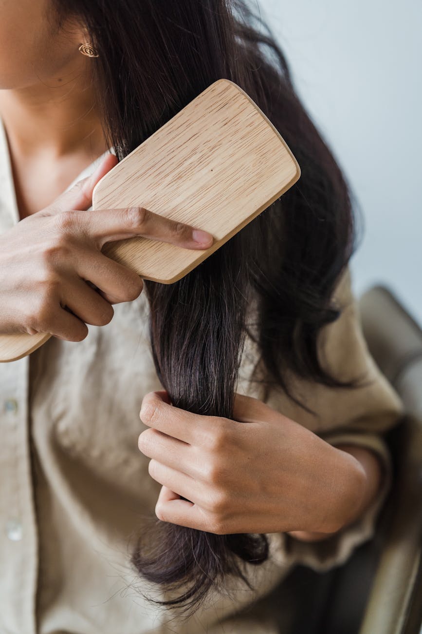 a woman brushing her long hair