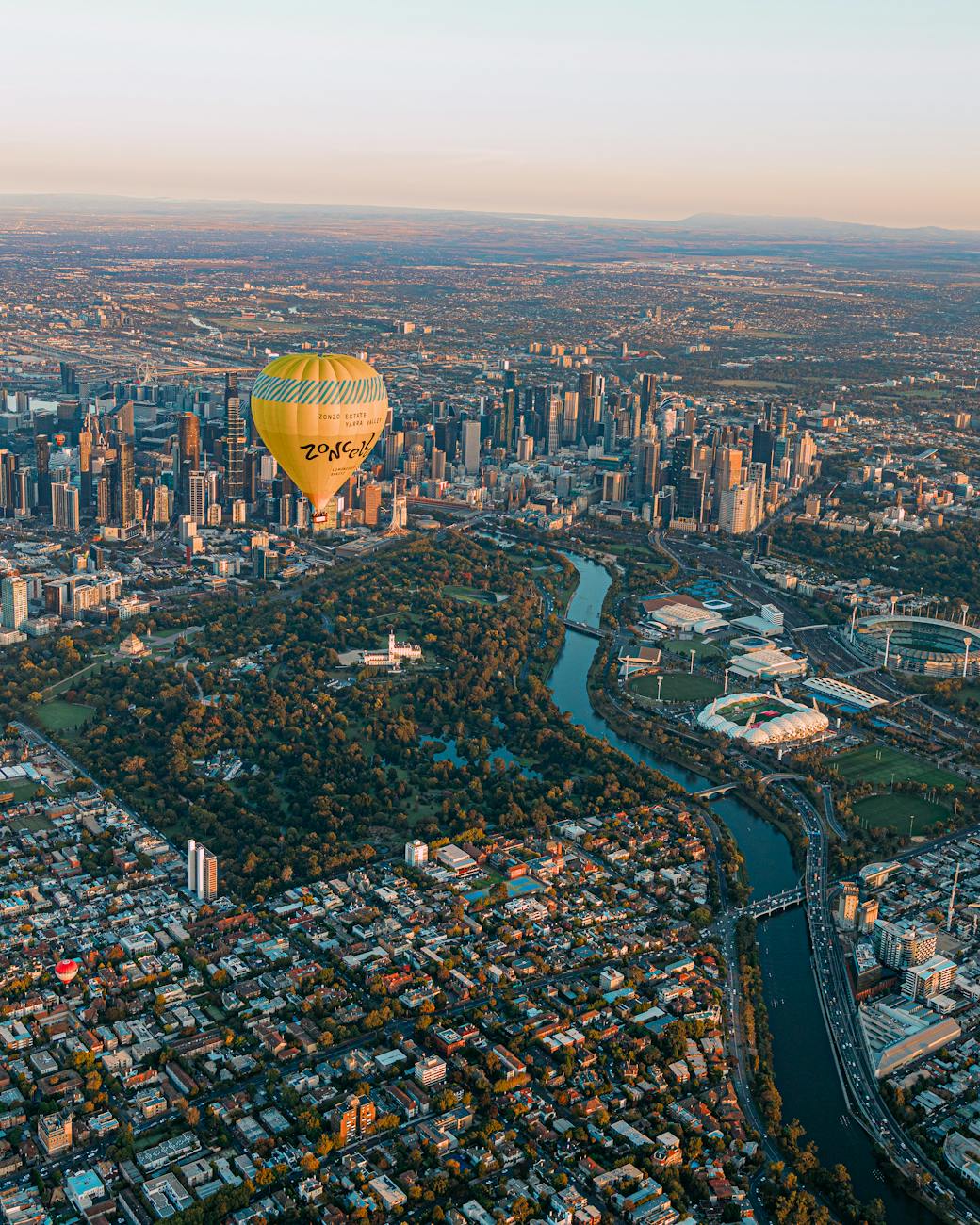 aerial view of hot air balloon over melbourne skyline