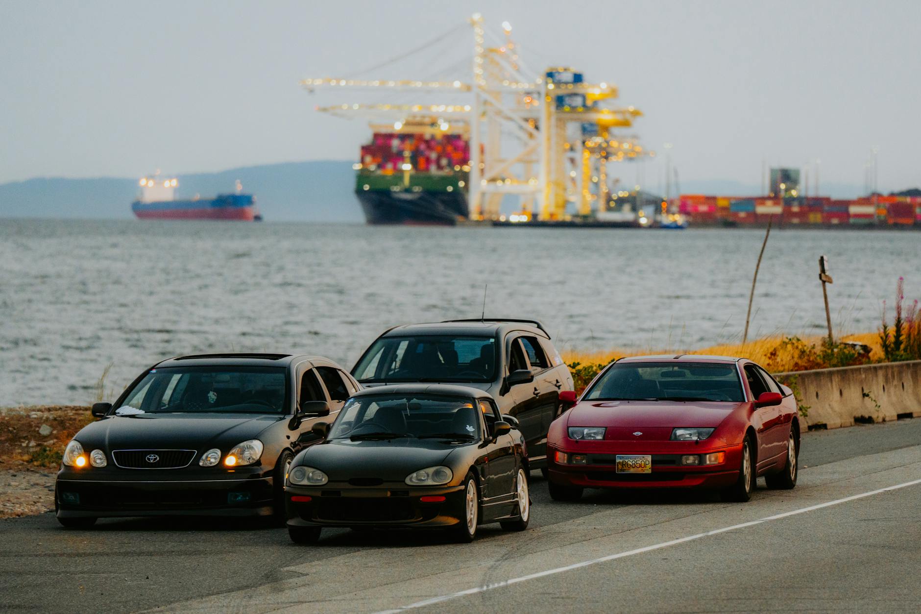 a group of cars parked on the side of the road