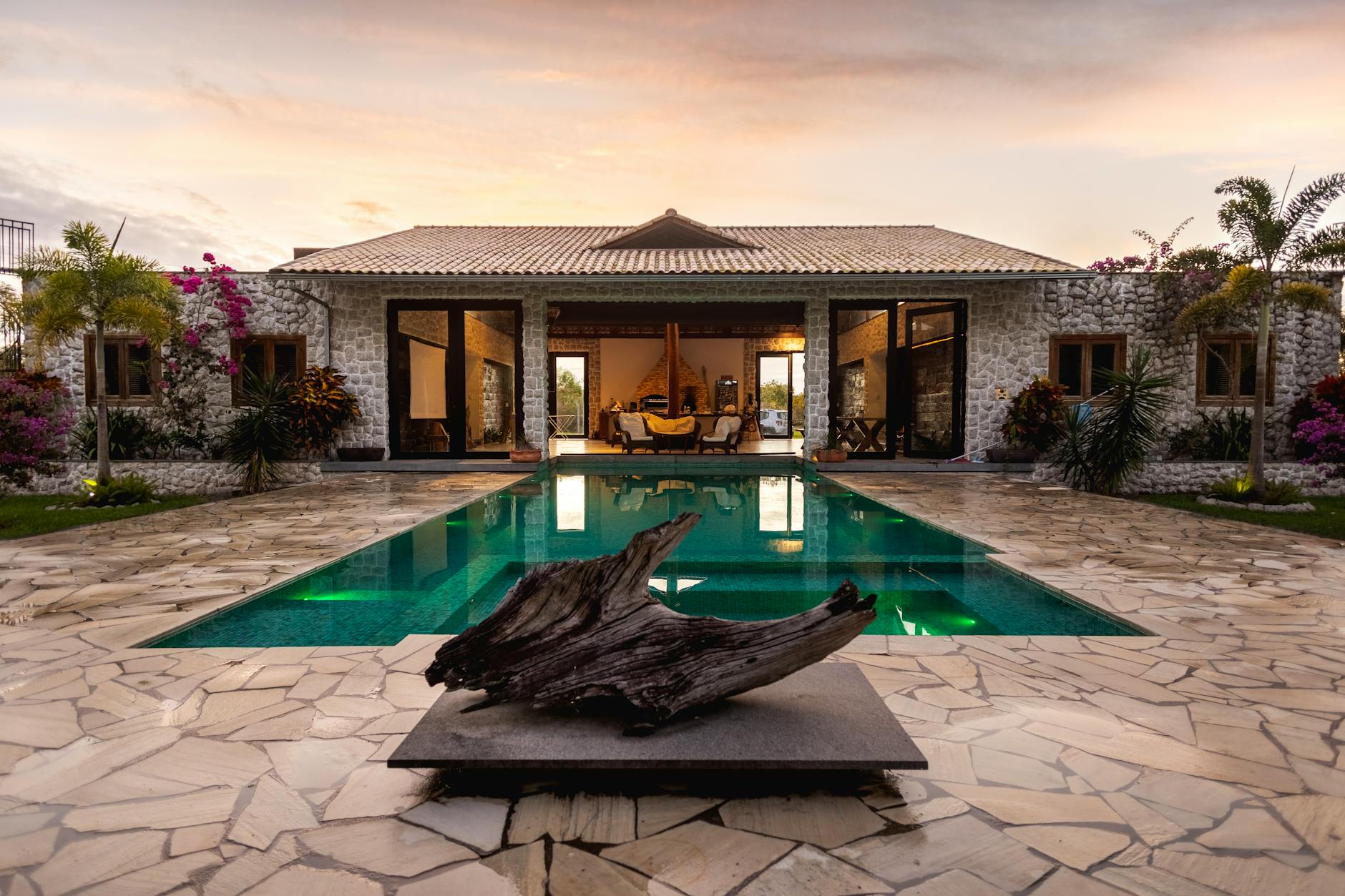luxury villa with pool at sunset