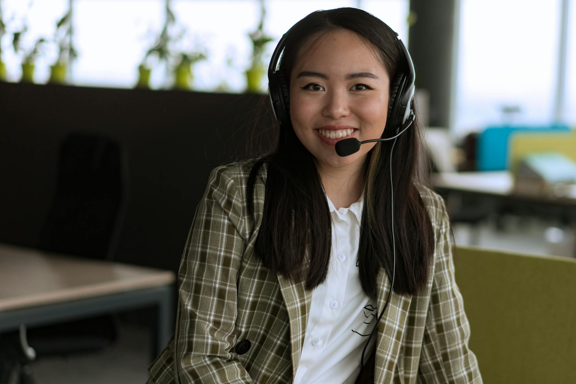 a woman smiling using headphones