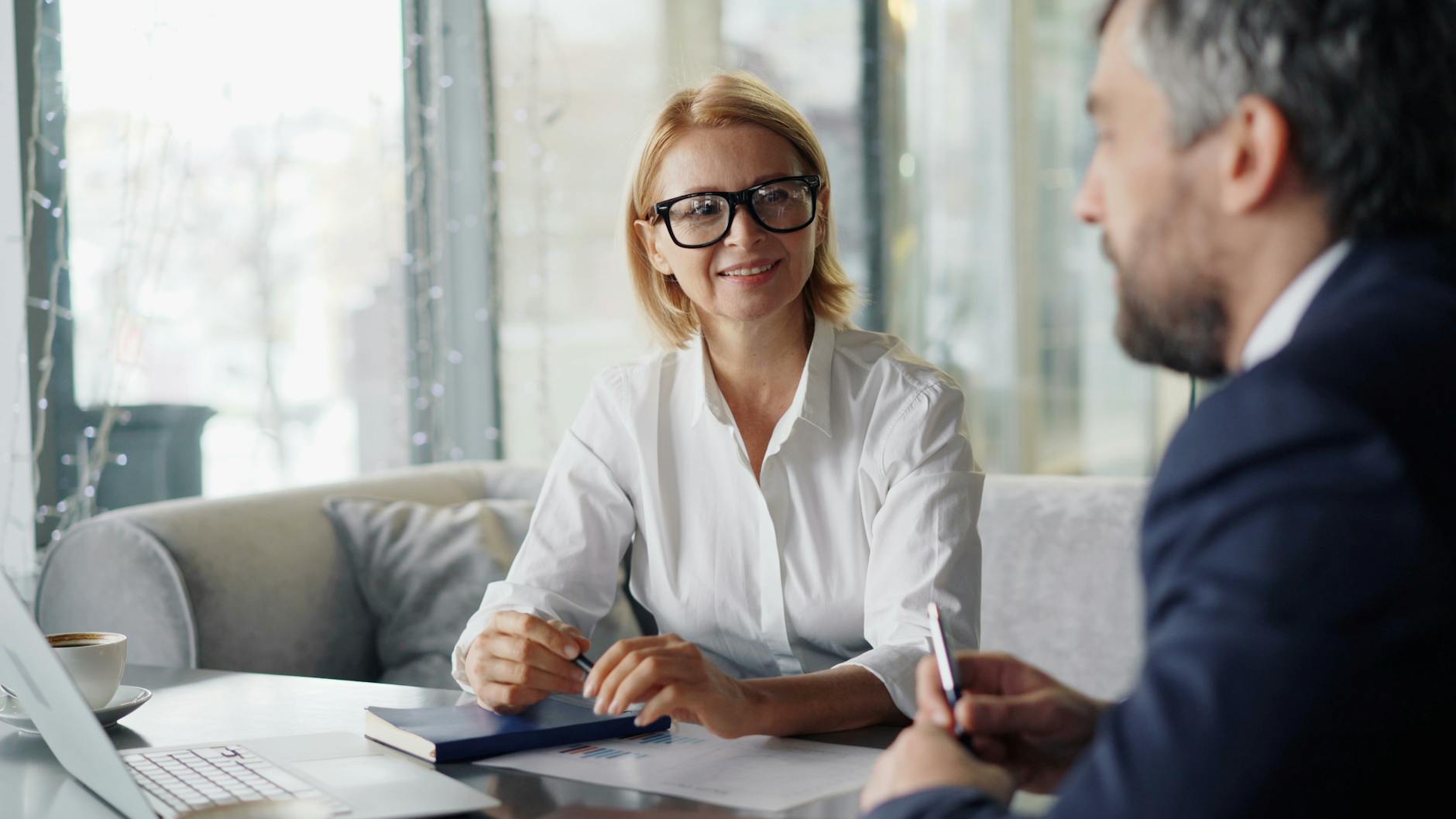 two people talking in an office setting