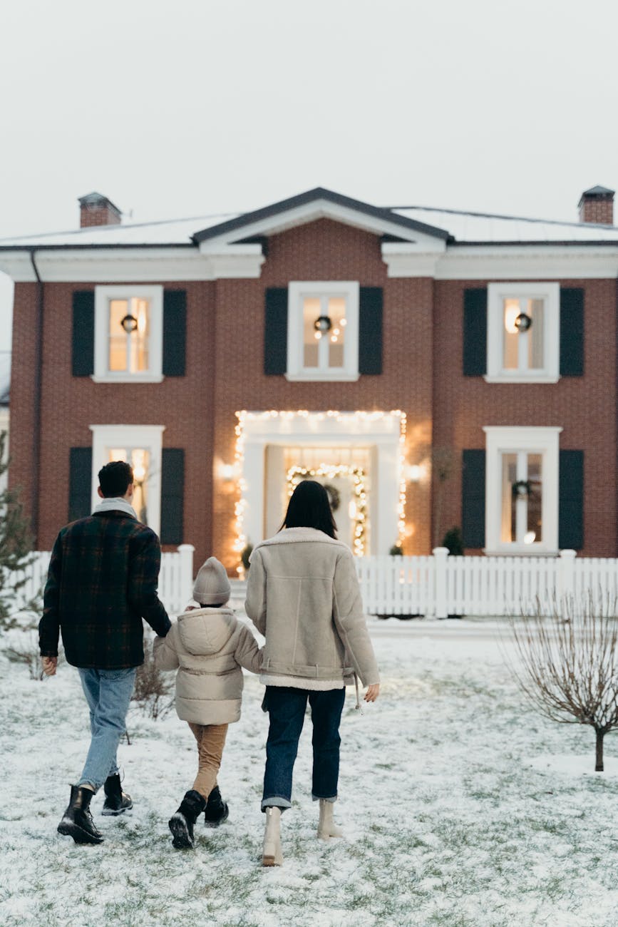a family walking towards a house