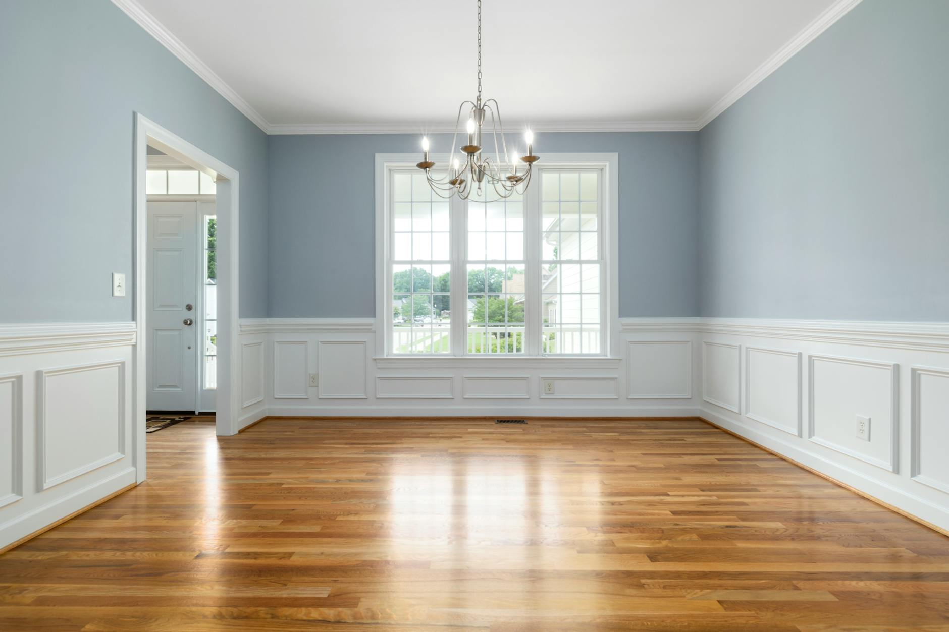blue and white wall with brown wooden floor