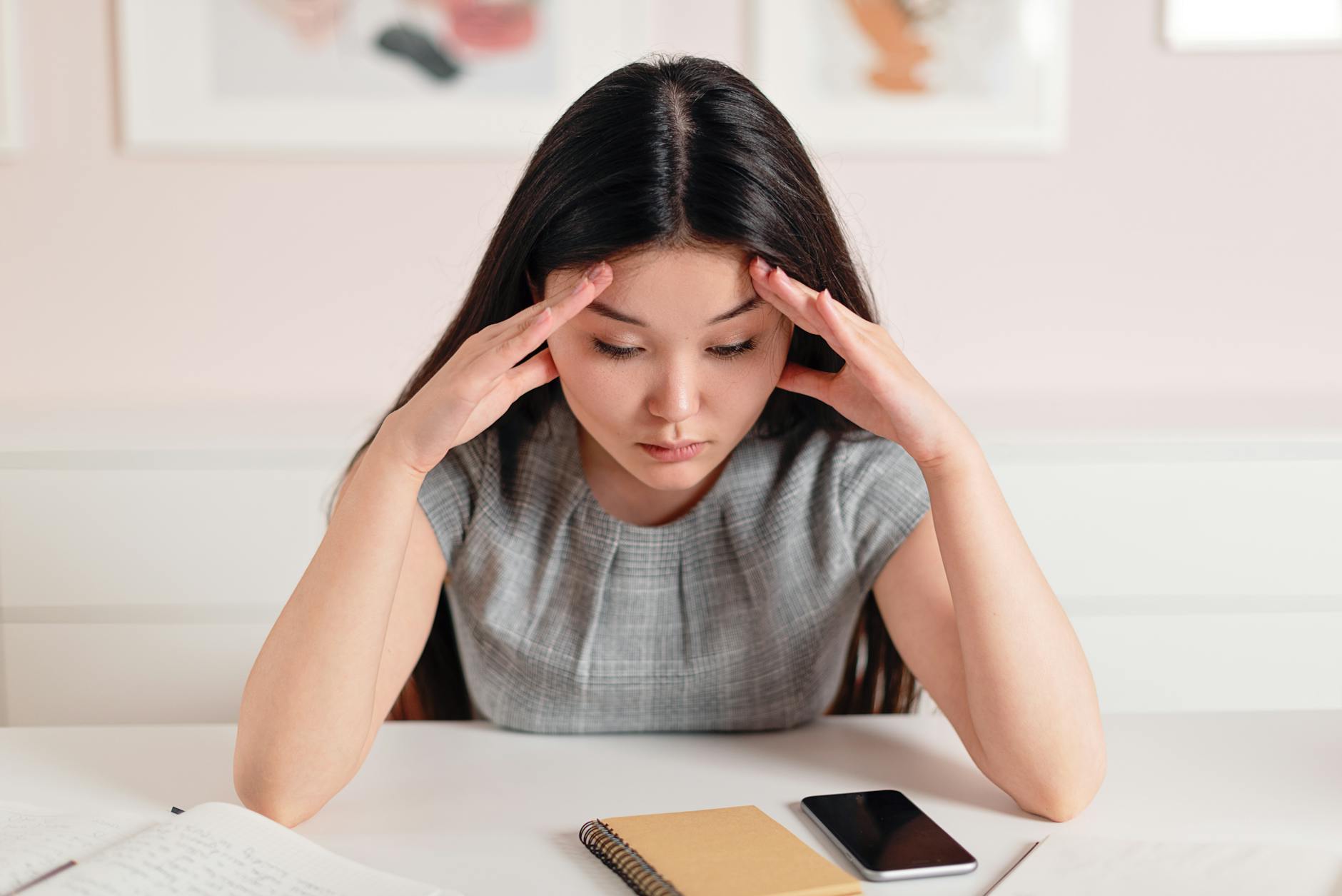 photo of a woman with her hands on her head