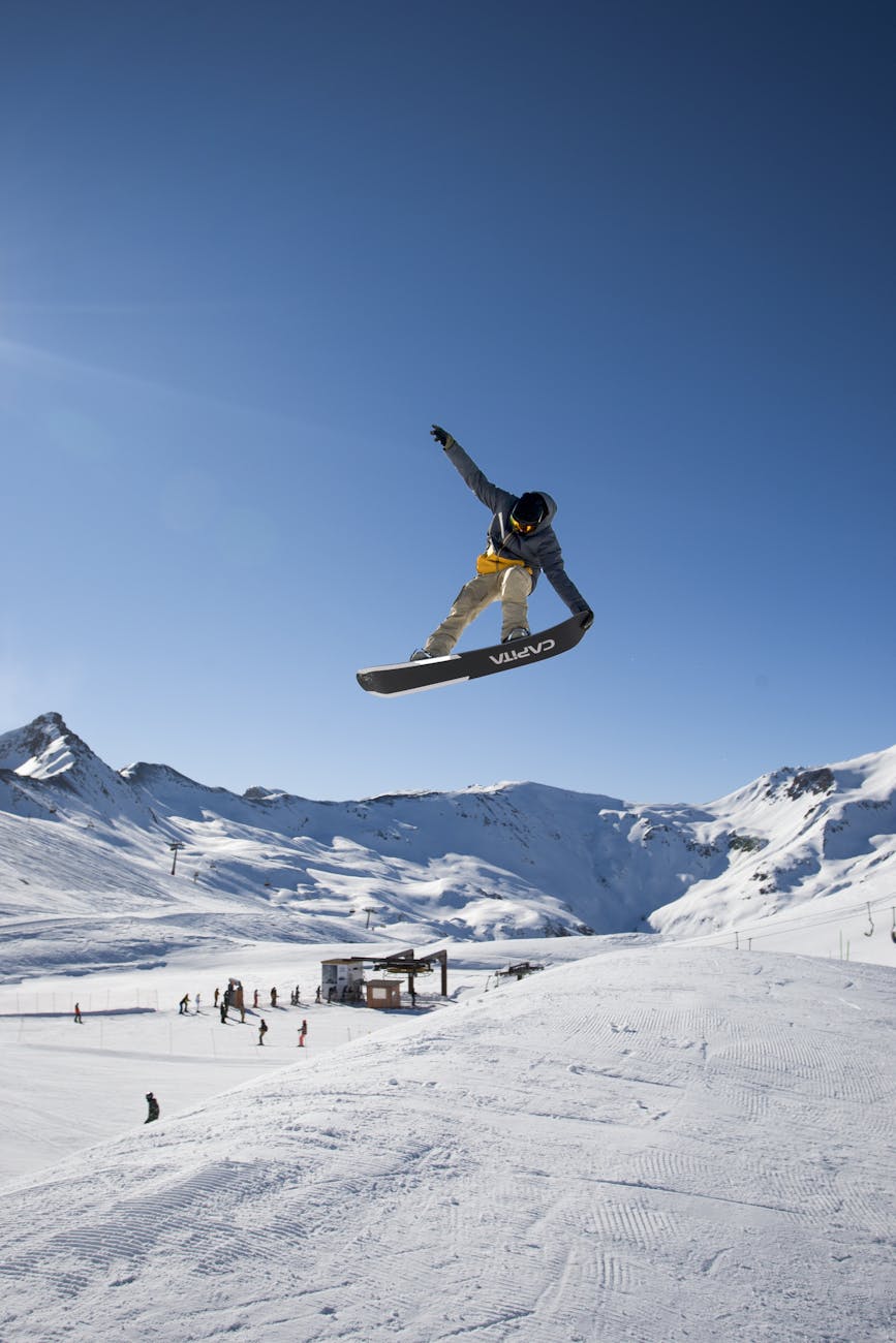 snowboarder in mid air trick at livigno