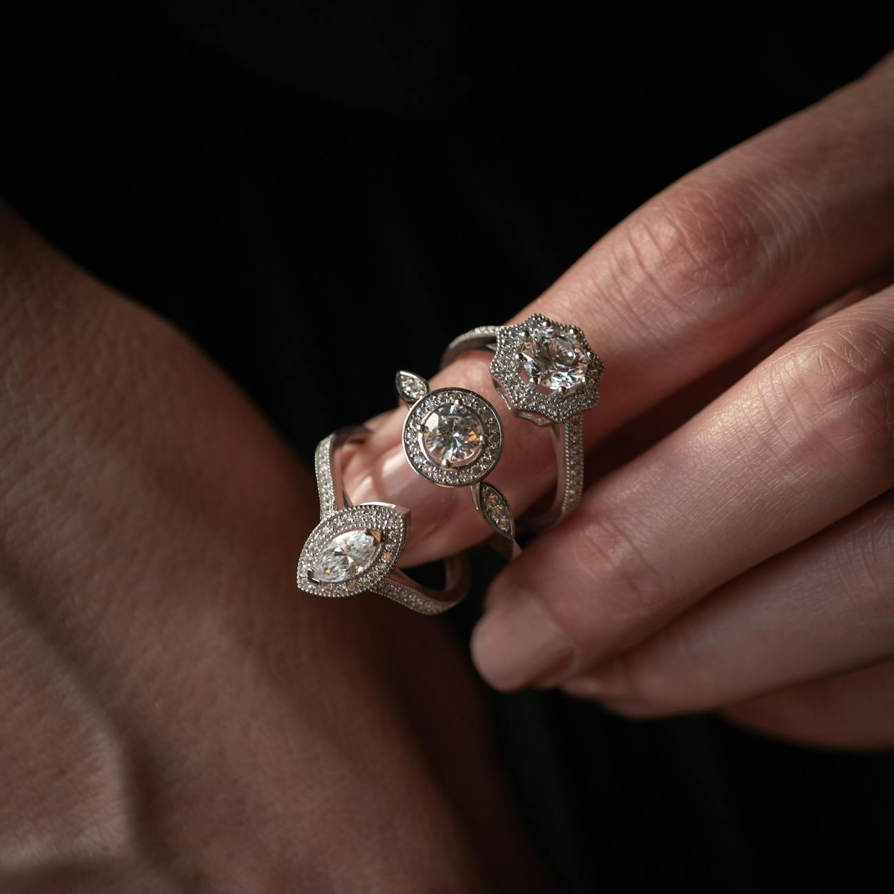 elegant diamond ring collection in hand