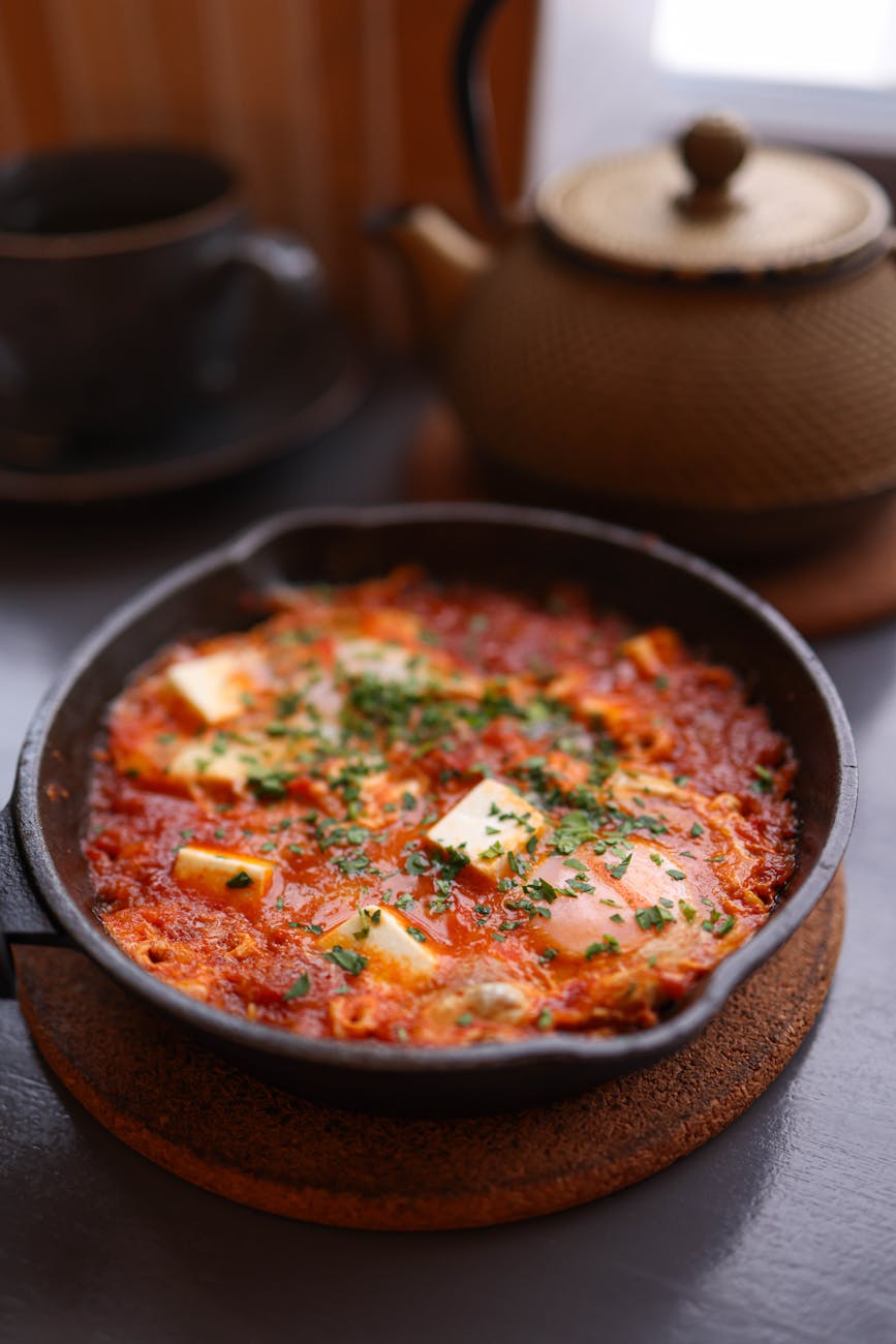 rustic shakshuka with herbs and cheese