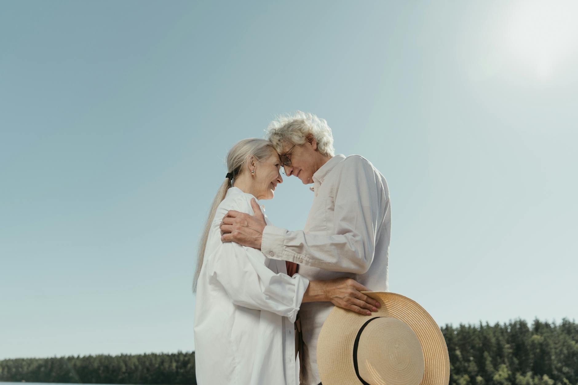 an elderly couple looking at each other