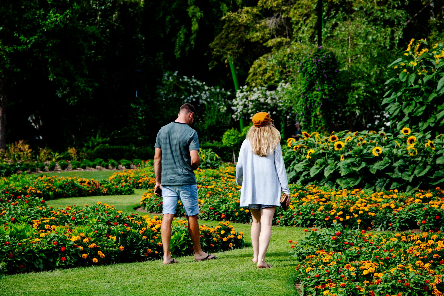 a man and a woman in a botanical garden