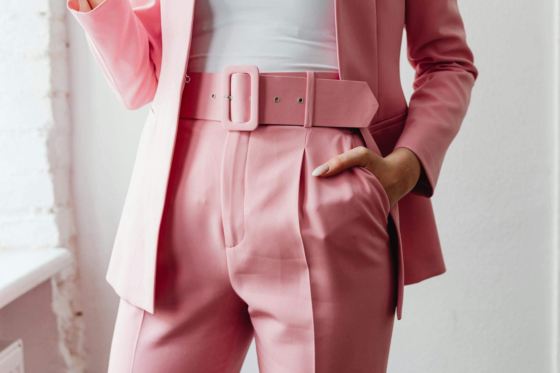 woman in pants with hand in pocket