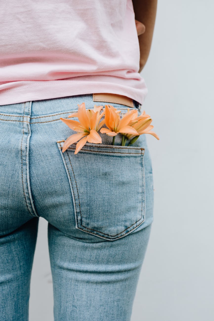 back view of woman with flowers in pocket