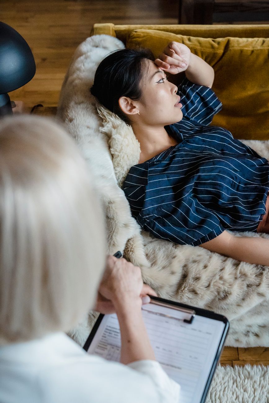 young woman lying on a sofa at therapy