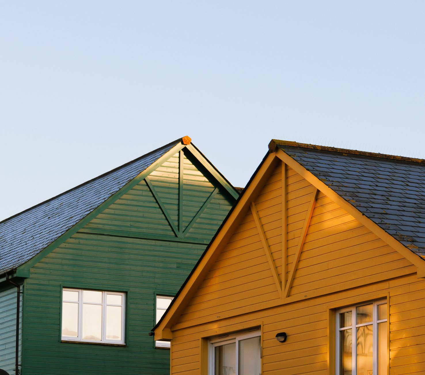 colorful wooden house roofs at sunset