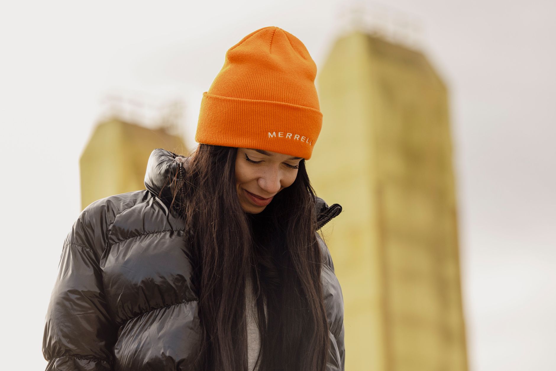 outdoor portrait of woman in orange beanie