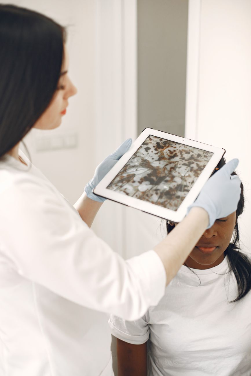 doctor examining patient using a gadget