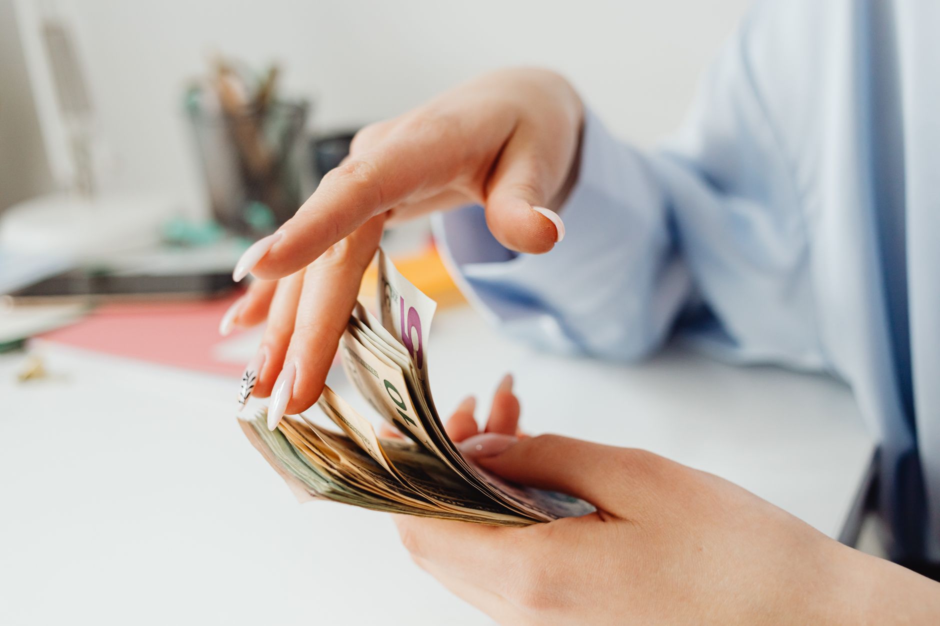 person holding american dollars
