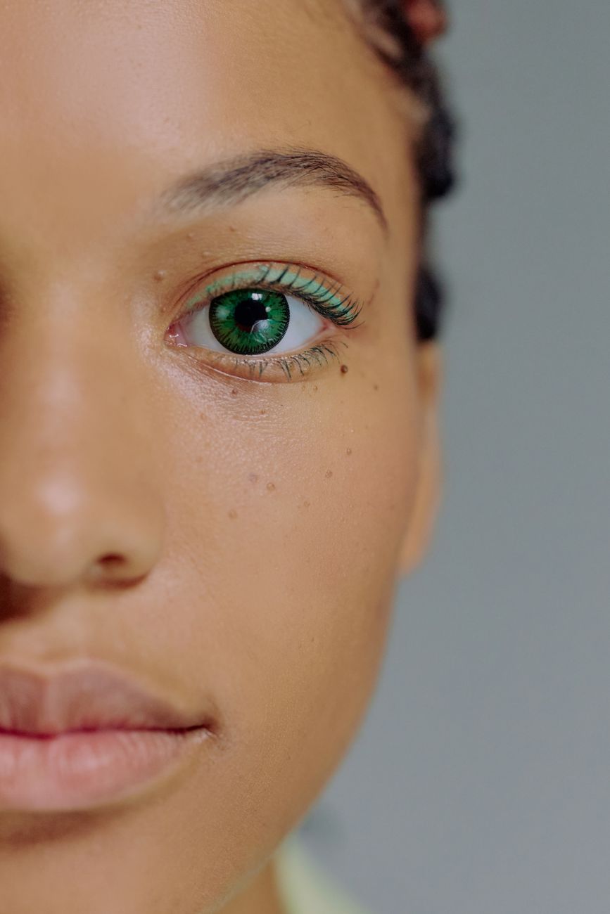 close up of face of woman with green eyes