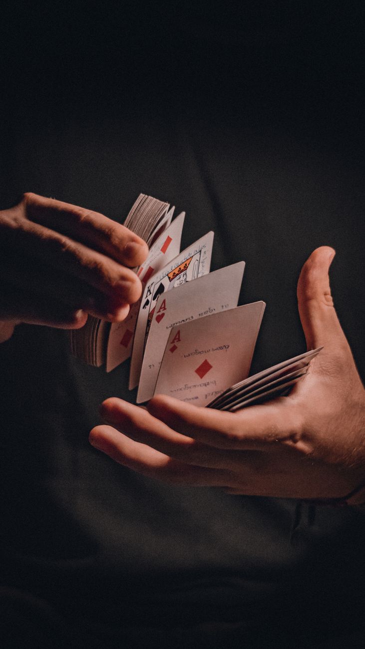 a person holding a deck of cards