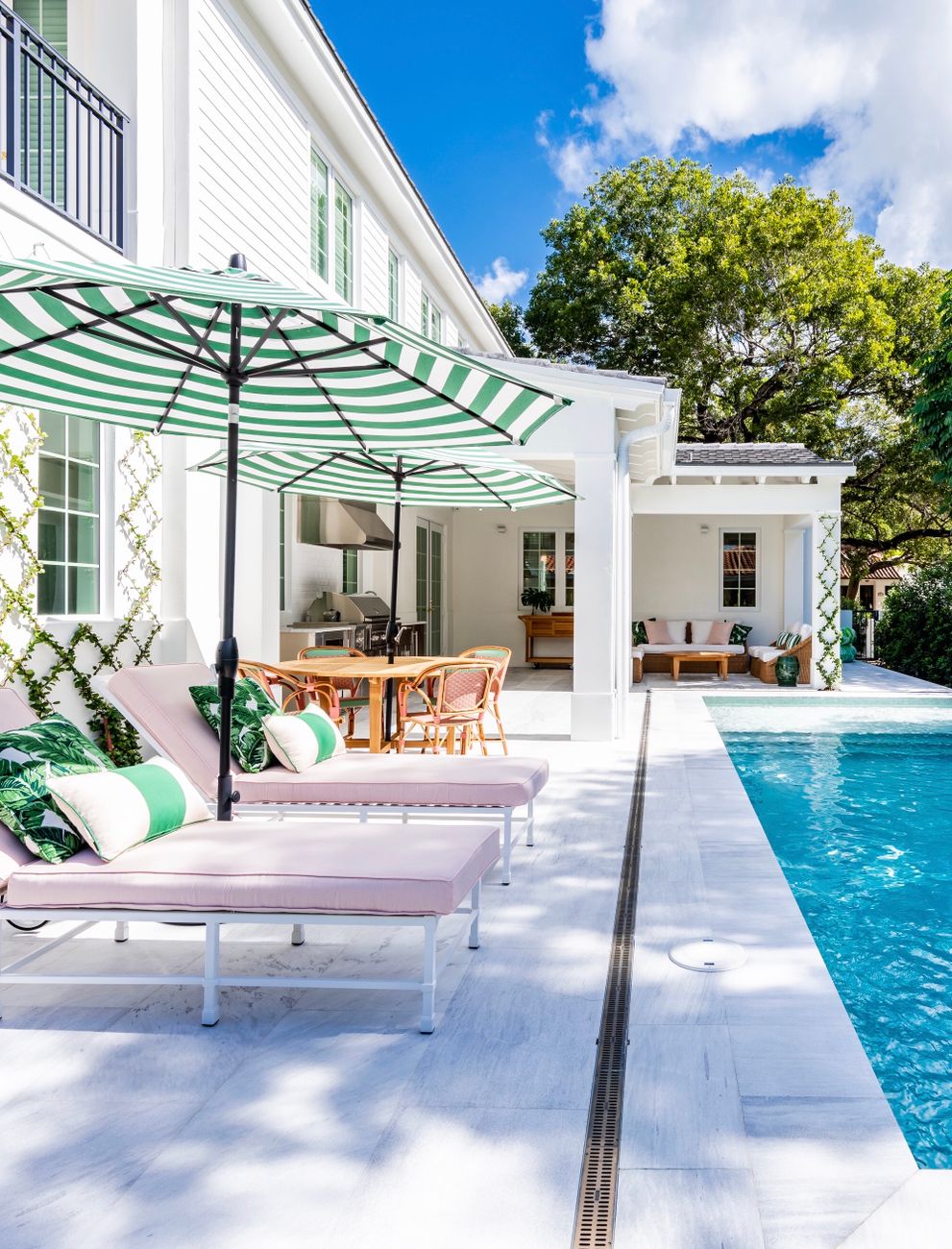 sun loungers and umbrellas by the pool in a resort