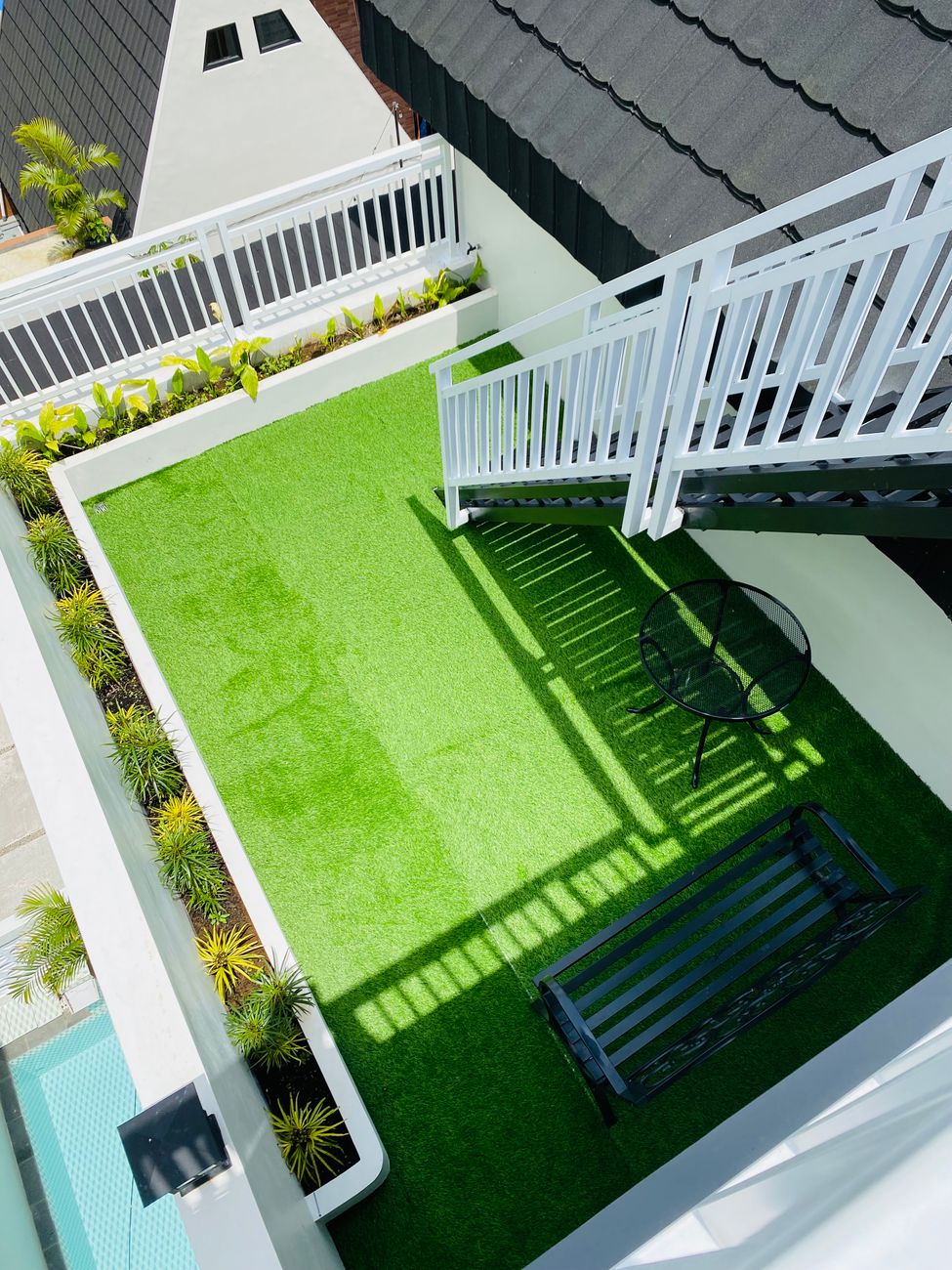 modern rooftop terrace with green turf
