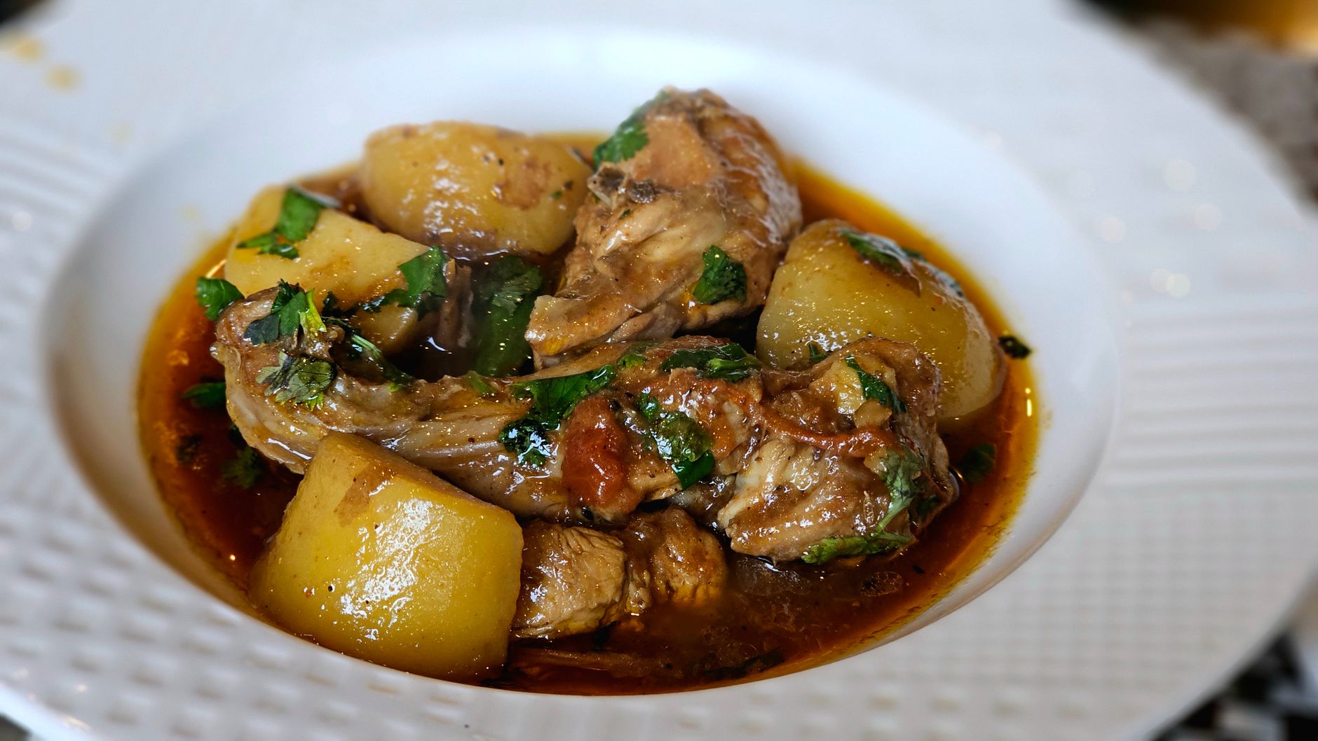 delicious chicken stew with potatoes and herbs
