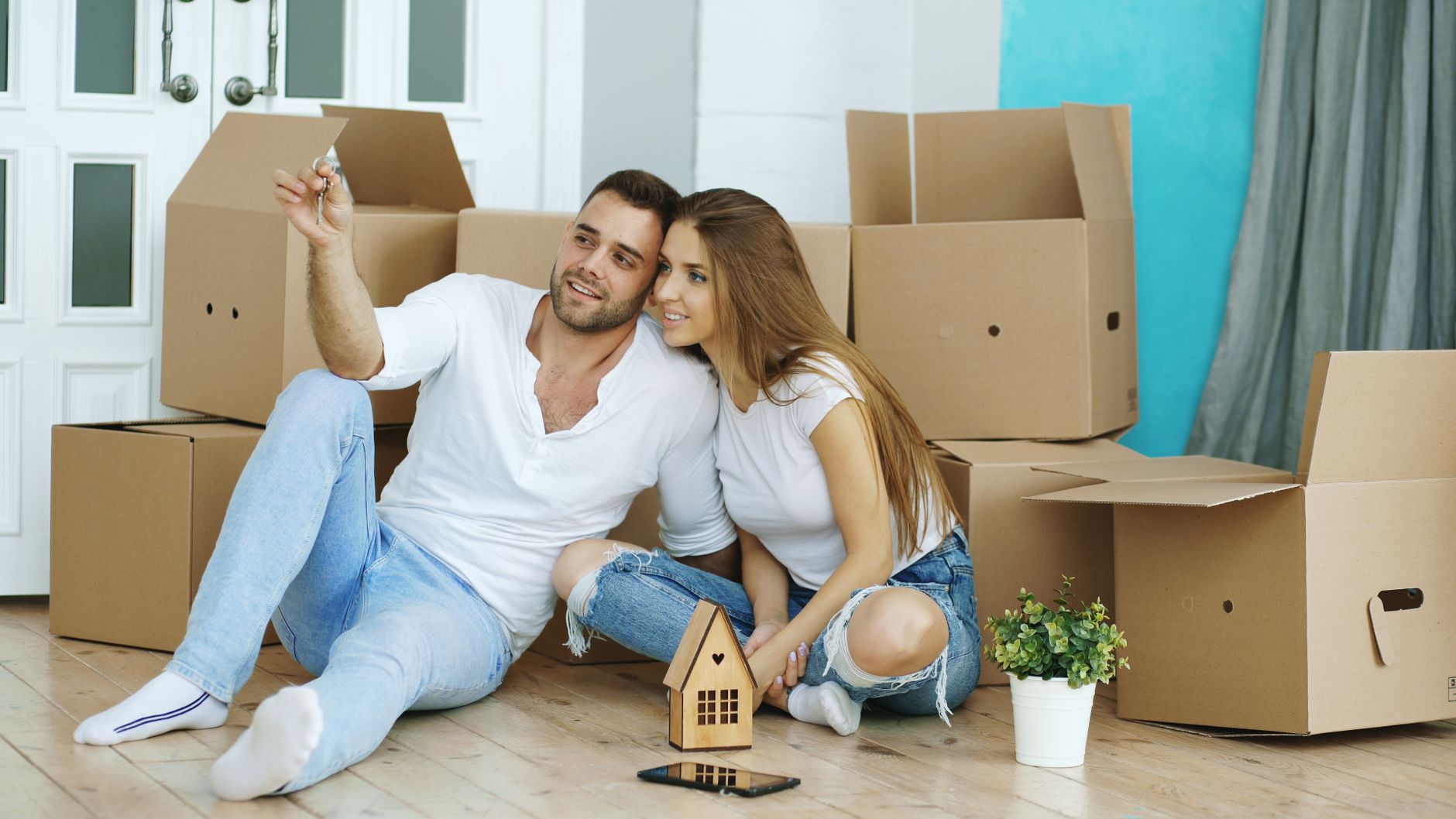 happy couple celebrating new home purchase