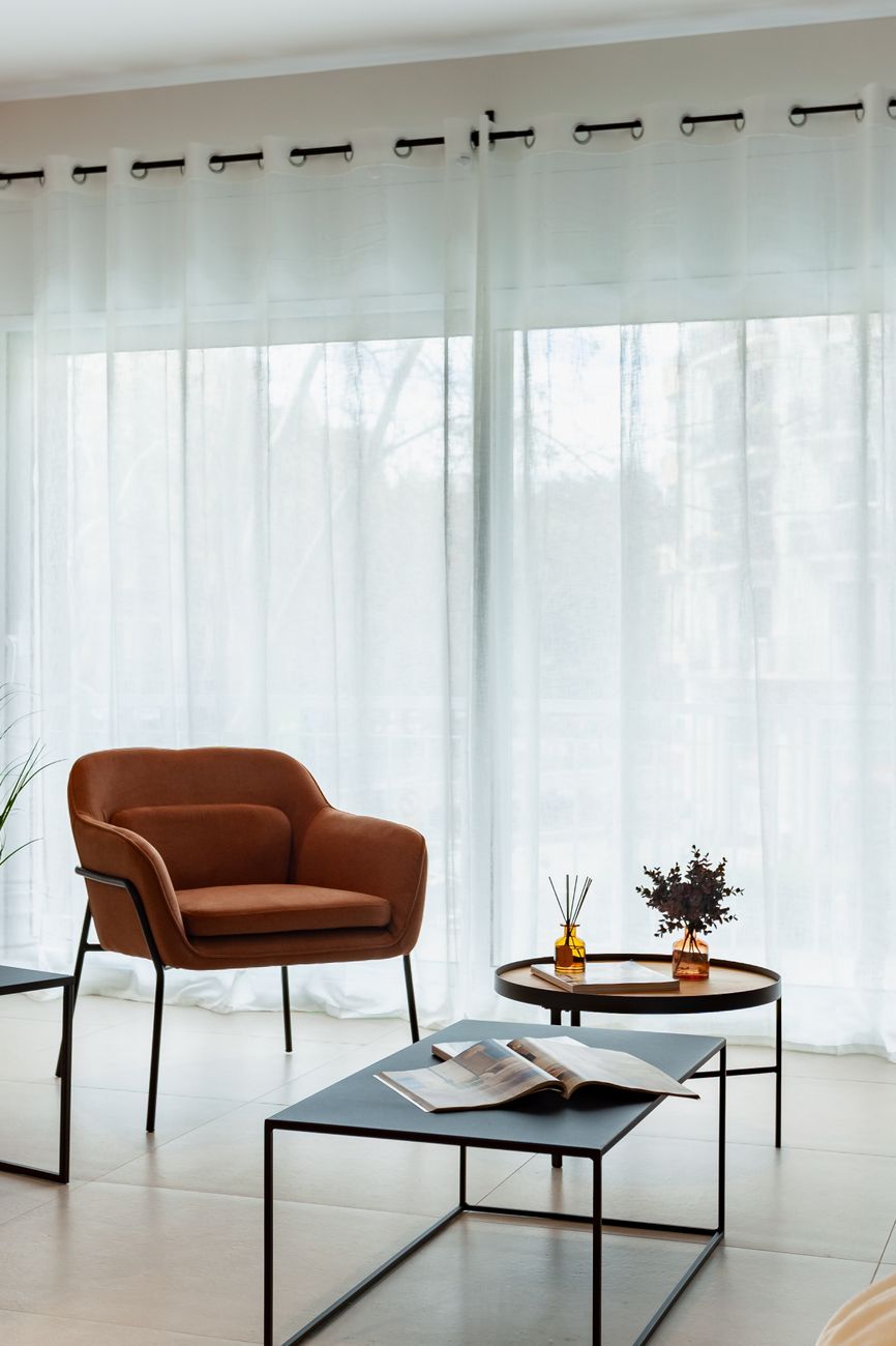 modern living room with brown armchair in barcelona