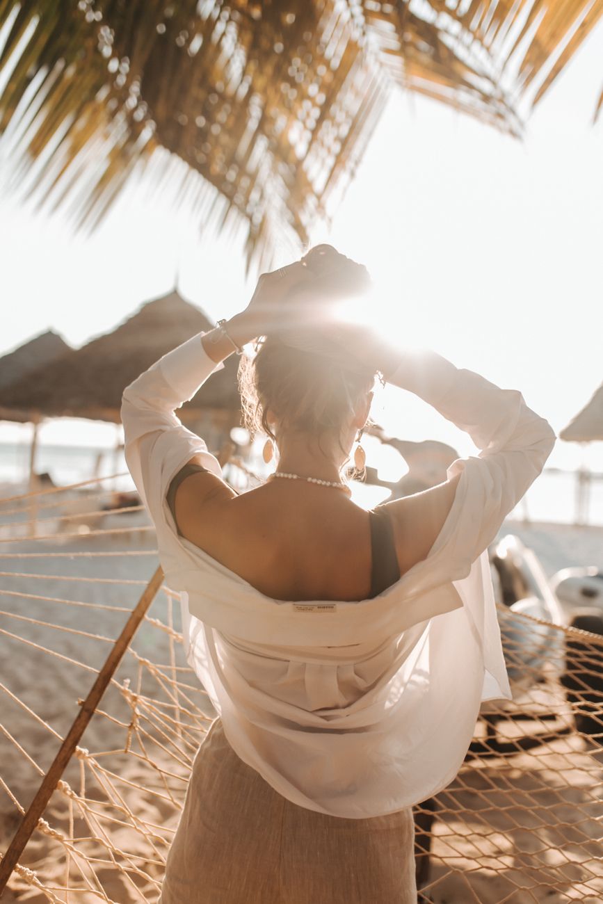 a woman arranging her hair