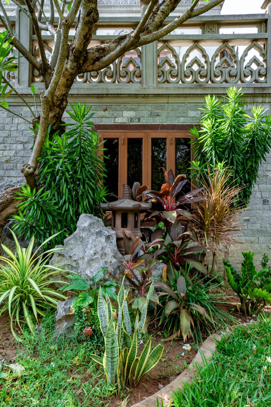 garden landscape near gray concrete house