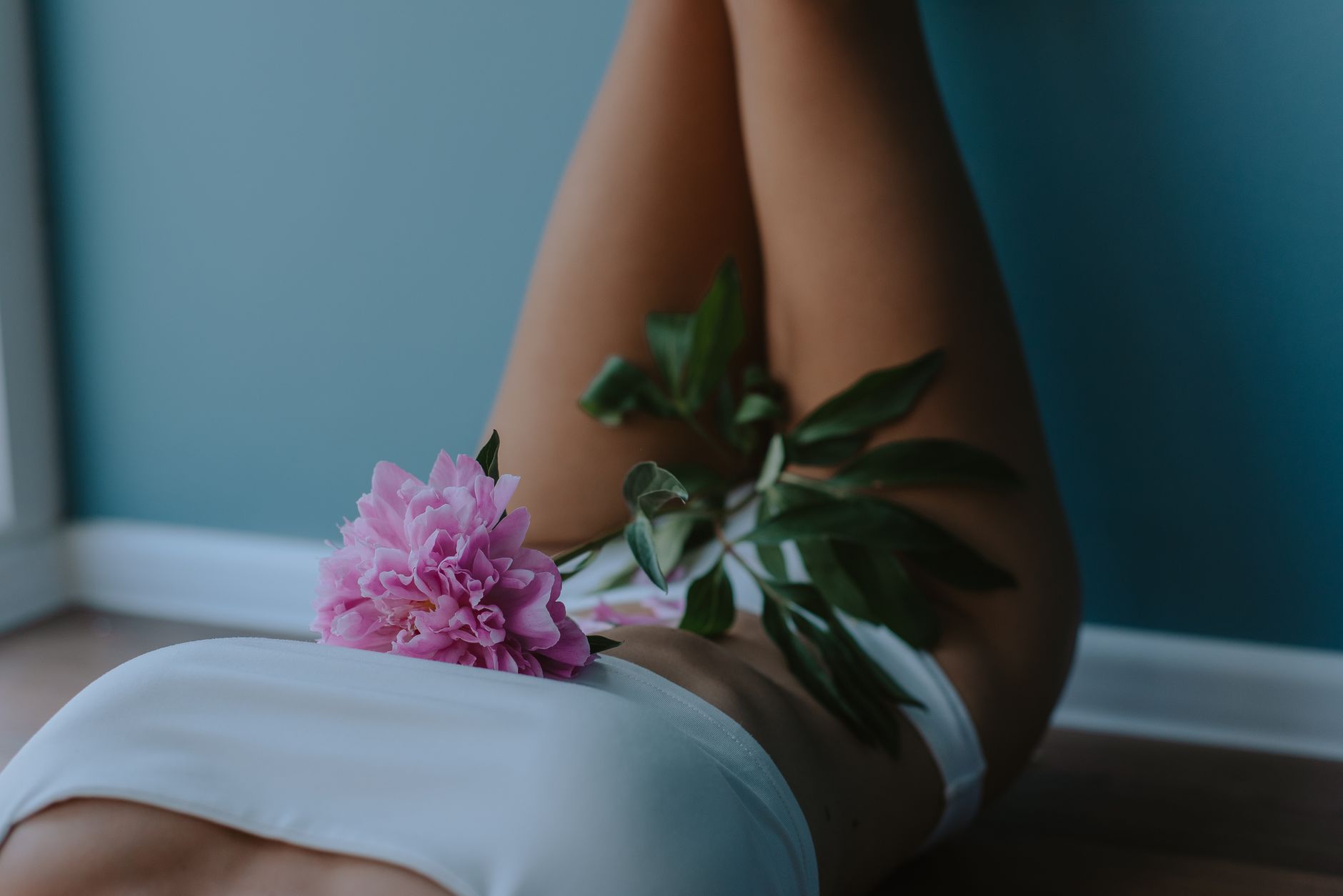 pink flower on a woman s tummy
