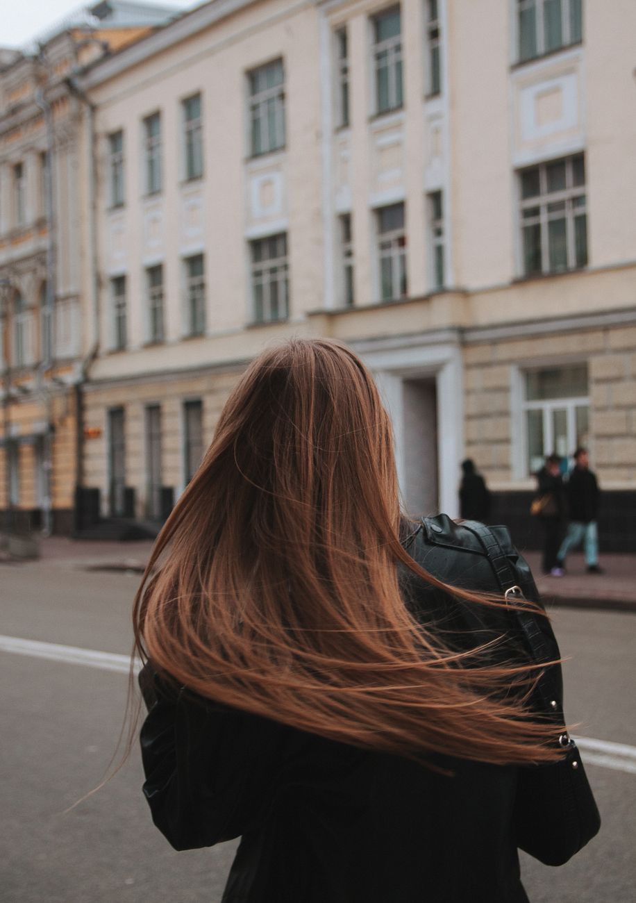 woman walking in a city