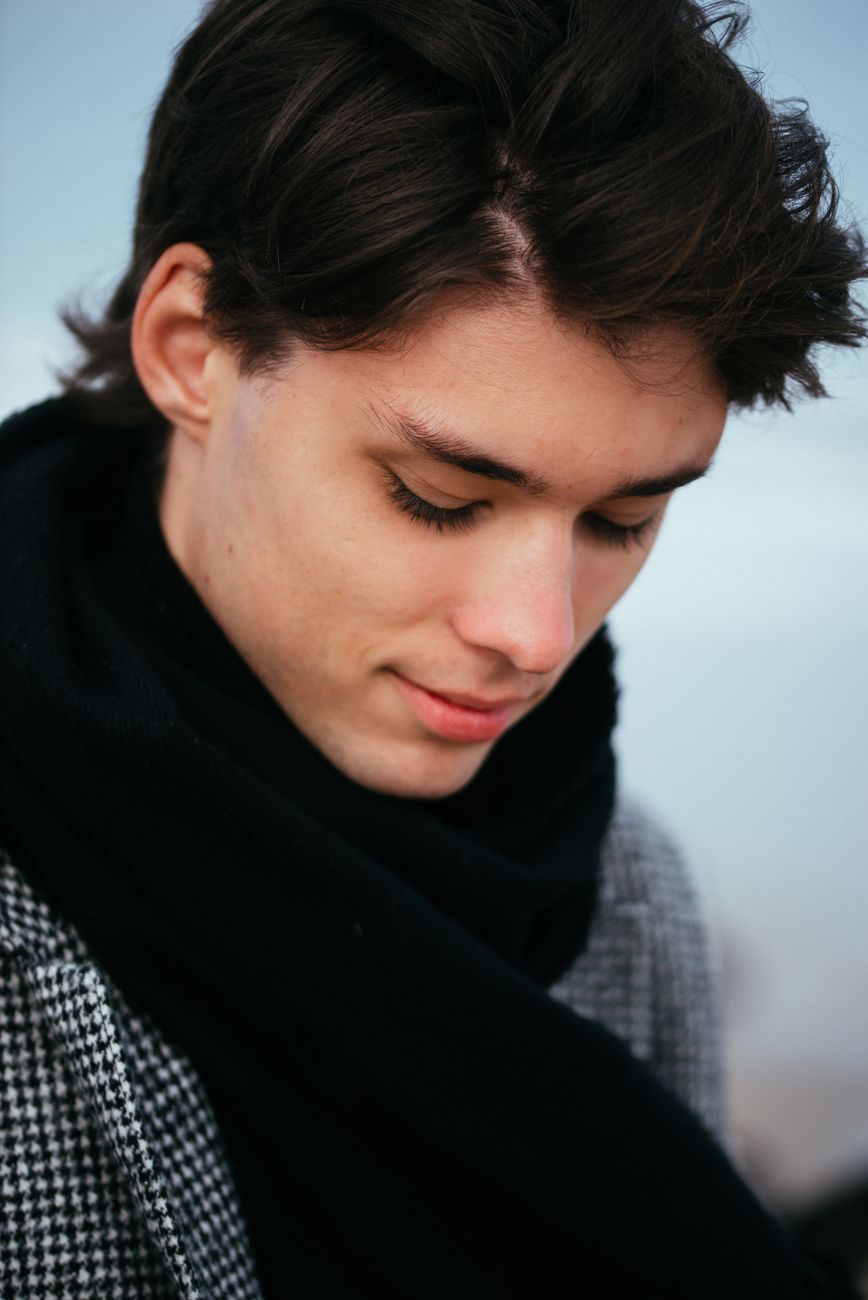 stylish young man in a winter scarf portrait