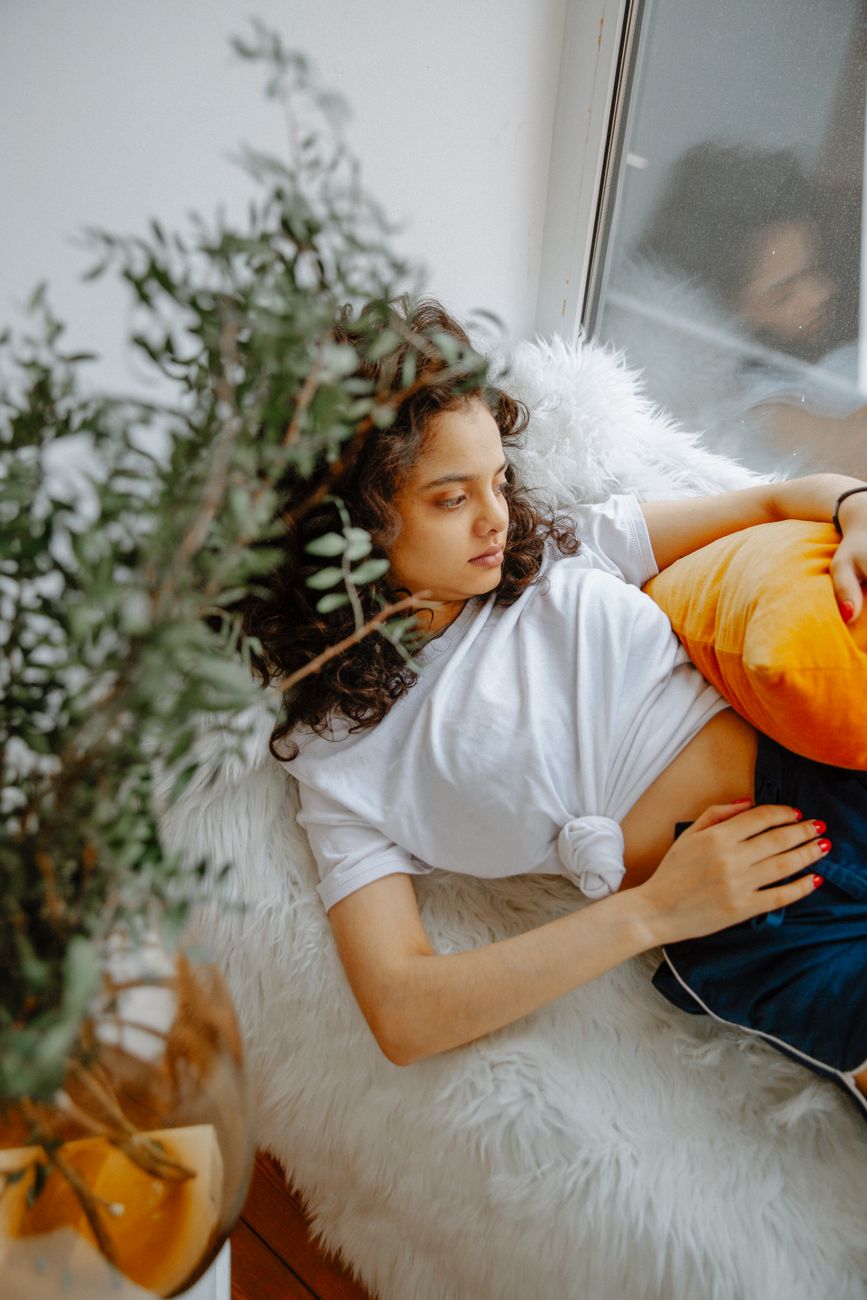 woman lying on couch