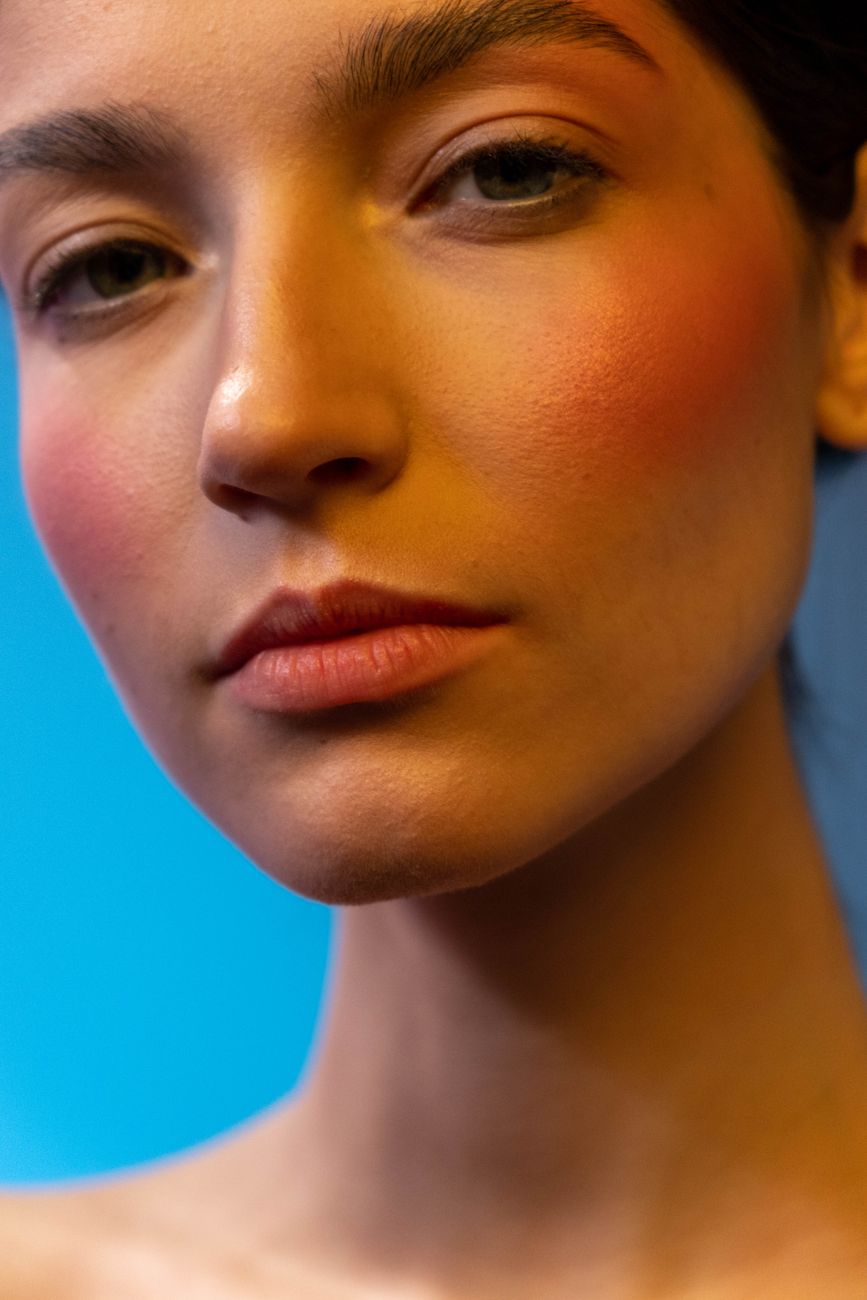 a woman with blush on in close up photography