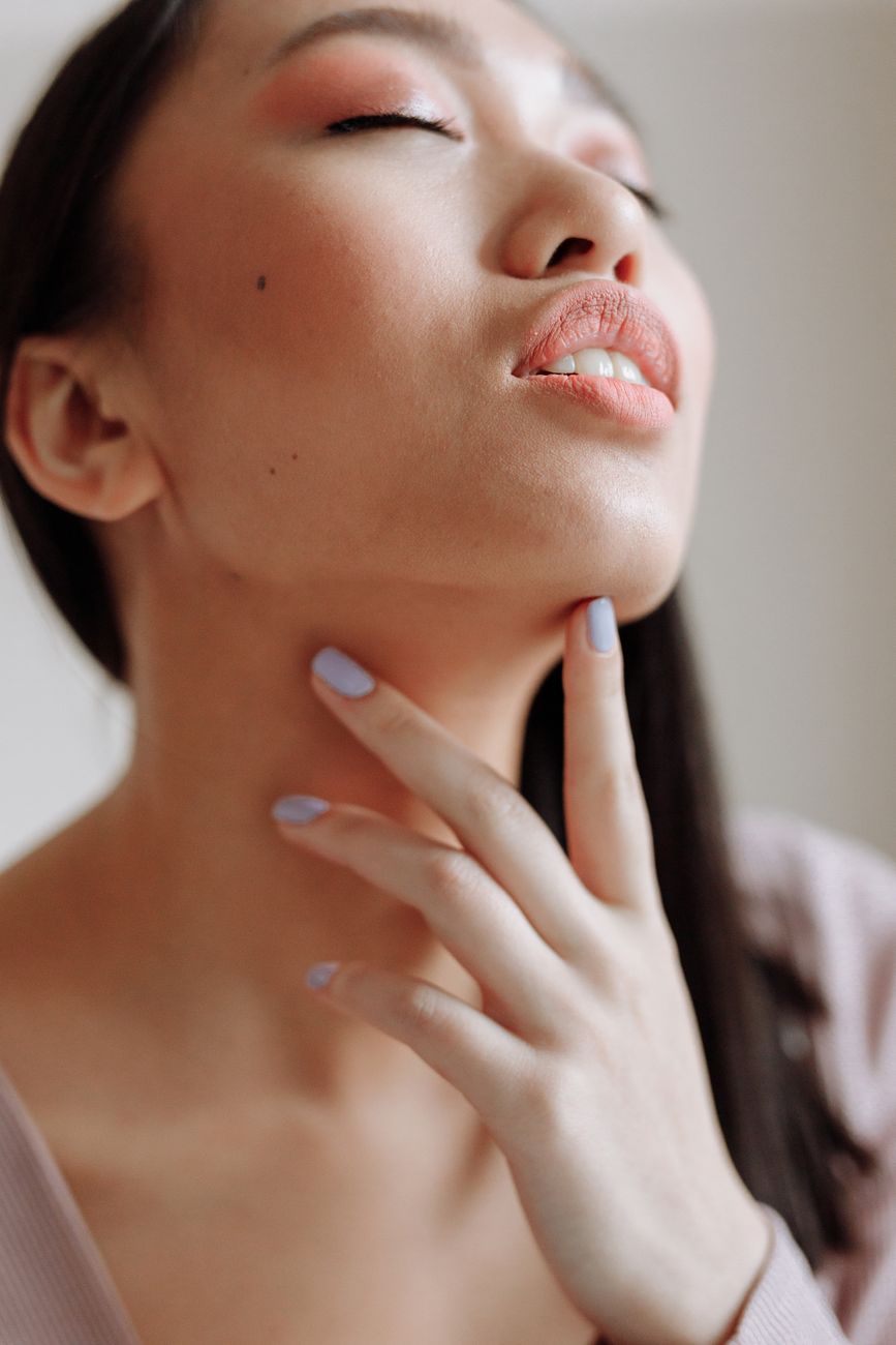 a woman with touching her chin