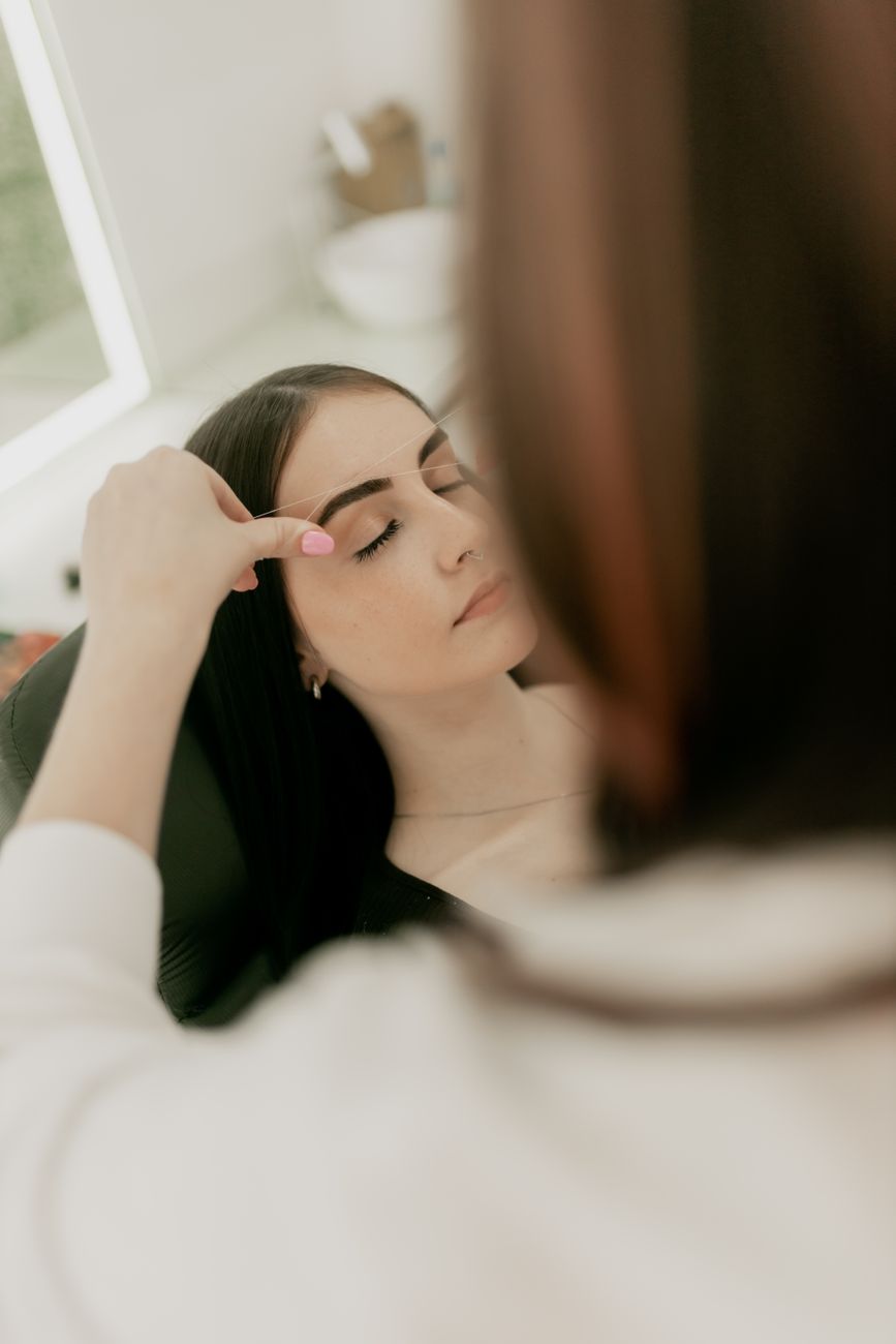 professional eyebrow shaping at beauty salon